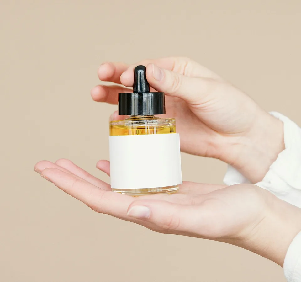 Serum dropper held against the light